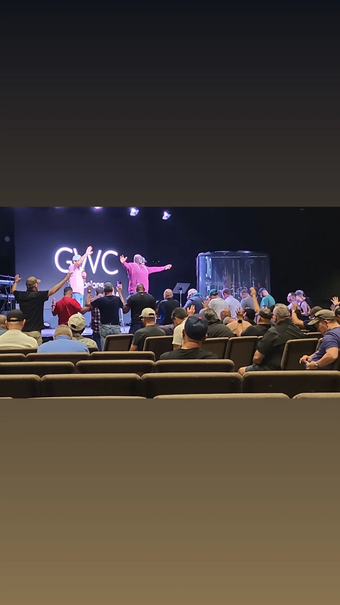 Corey Miller speaking to a faith gathering